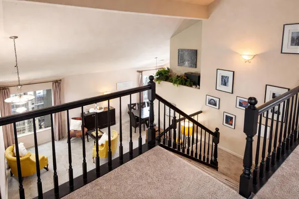 a view of staircase with railing and stairs