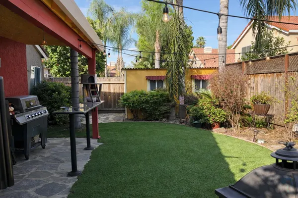 a view of a backyard with plants potted plants