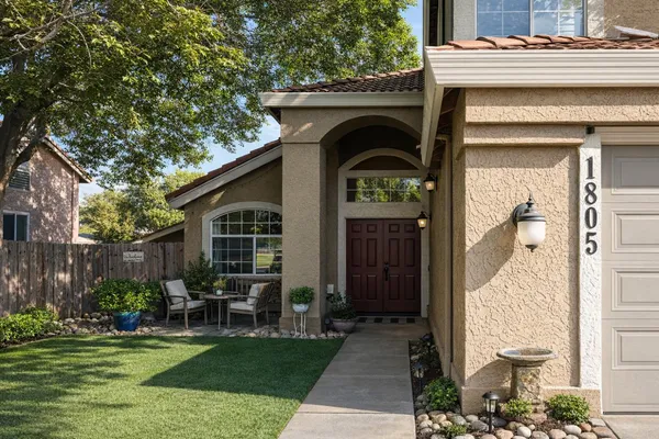 a front view of a house with garden