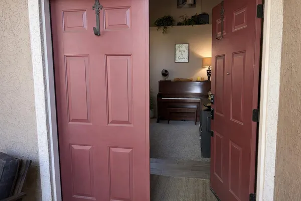 a kitchen with a refrigerator and cabinets