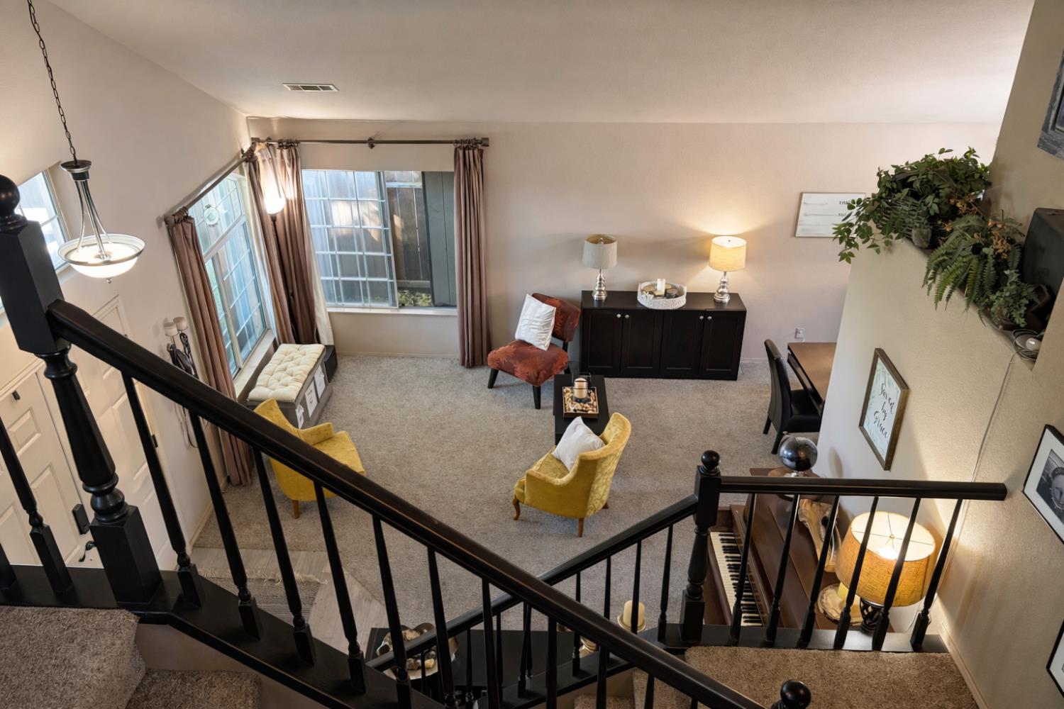 1805 Patton Drive Modesto, CA 95356 - Photo 8 of 15 a view of a livingroom with furniture hardwood floor and stairs