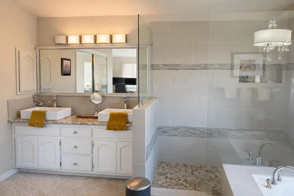 a bathroom with a sink and a mirror