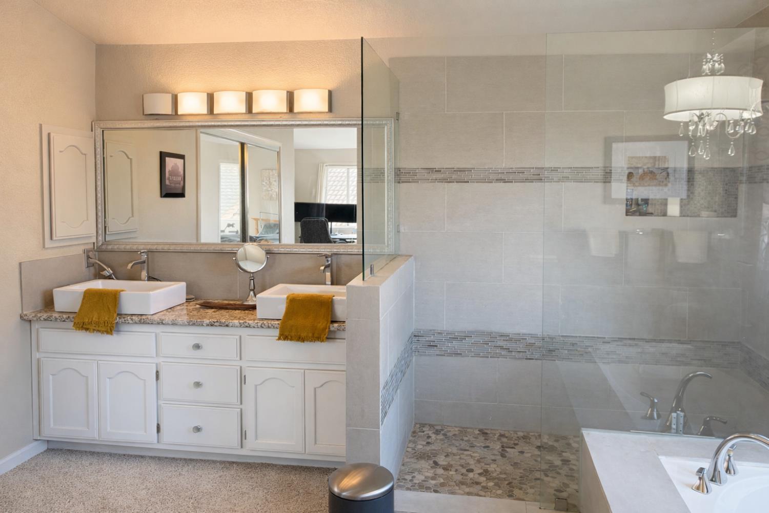 1805 Patton Drive Modesto, CA 95356 - Photo 10 of 15 a bathroom with a sink and a mirror