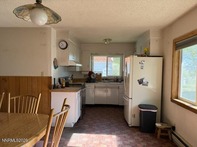 61 Rivers Road Smith, NV 89430 - Photo 32 of 57 a kitchen with a refrigerator and a stove