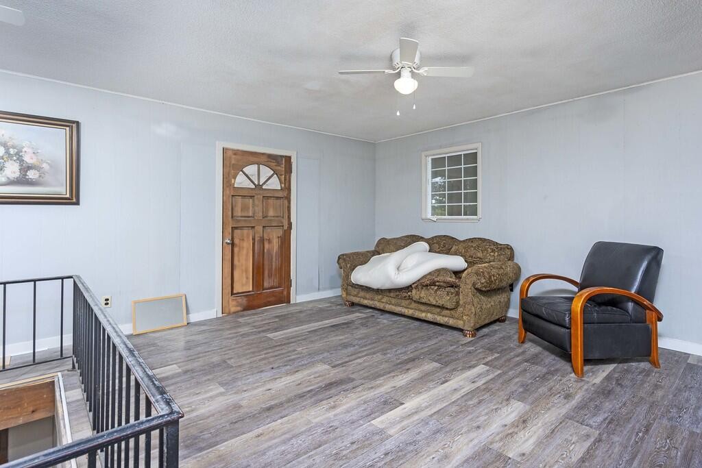 301305 Powerline Road Spring City, TN 37381 - Photo 8 of 30 a bedroom with furniture and wooden floor