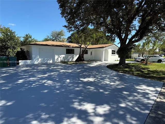 a house view with a backyard space