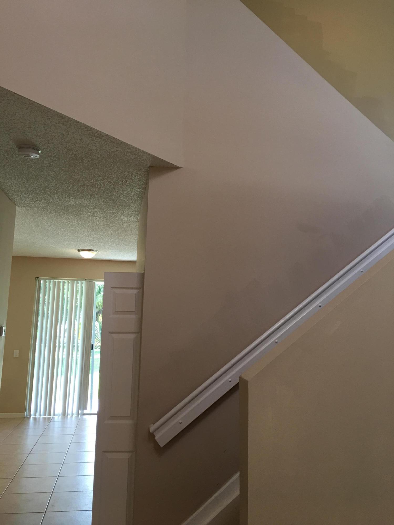 4383 Laurel Ridge Circle Weston, FL 33331 - Photo 13 of 36 a view of a hallway with wooden floor