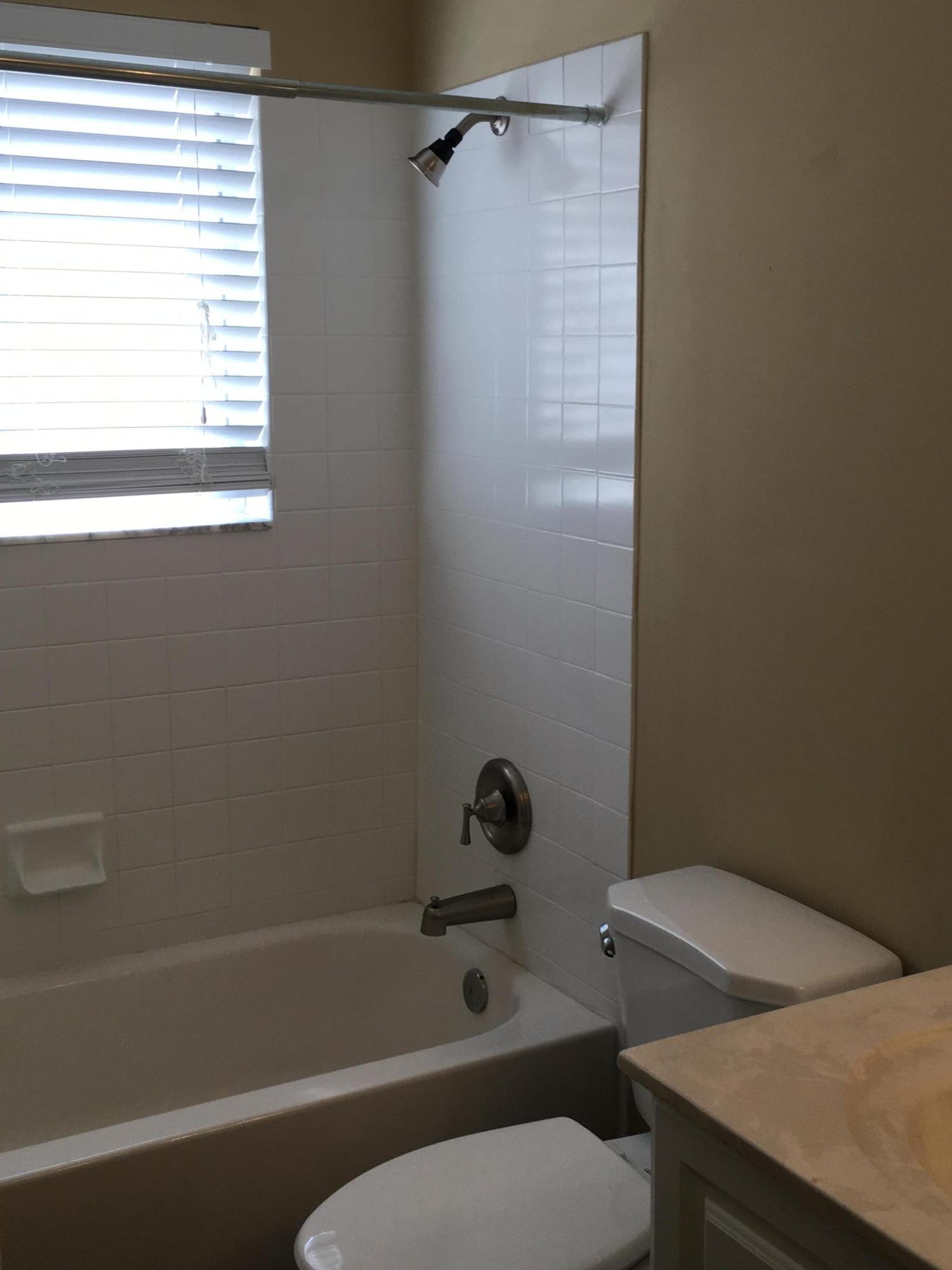 4383 Laurel Ridge Circle Weston, FL 33331 - Photo 20 of 36 a bathroom with a toilet and a bathtub