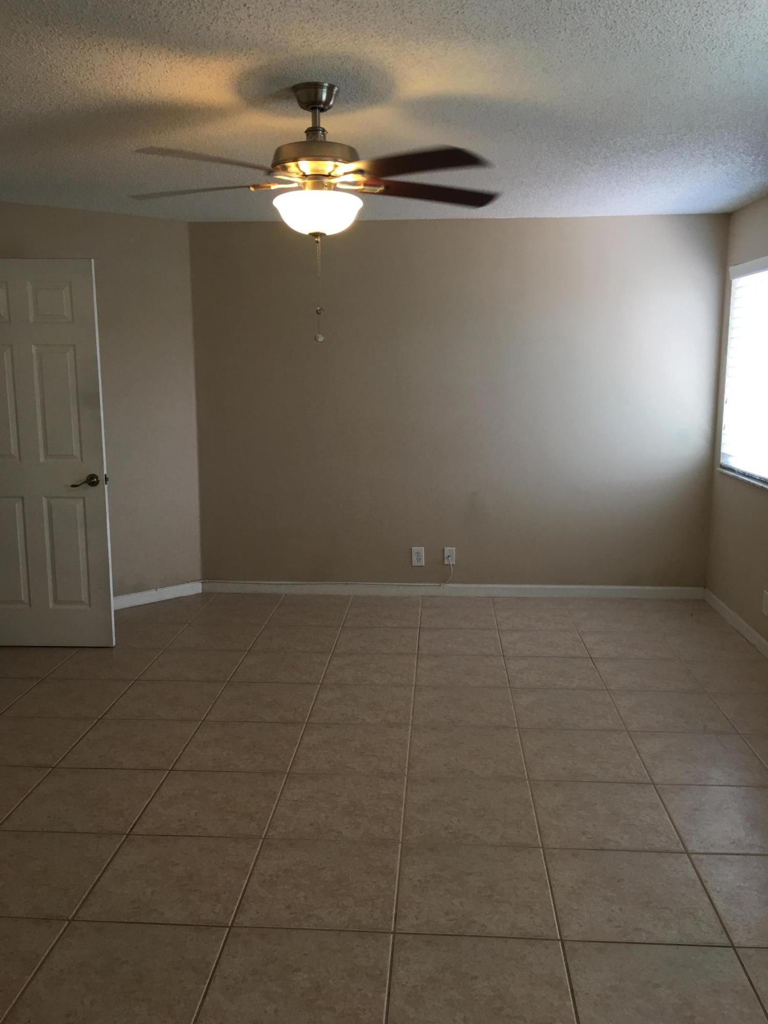 4383 Laurel Ridge Circle Weston, FL 33331 - Photo 22 of 36 a view of a livingroom with an empty space and a window