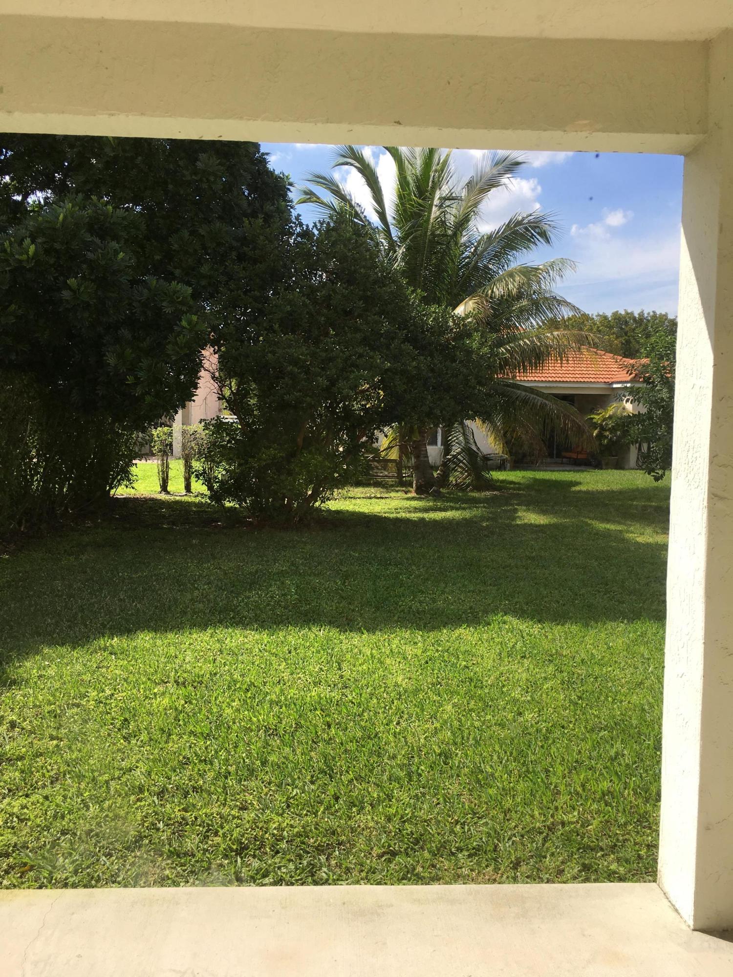 4383 Laurel Ridge Circle Weston, FL 33331 - Photo 28 of 36 a view of a lake from a yard