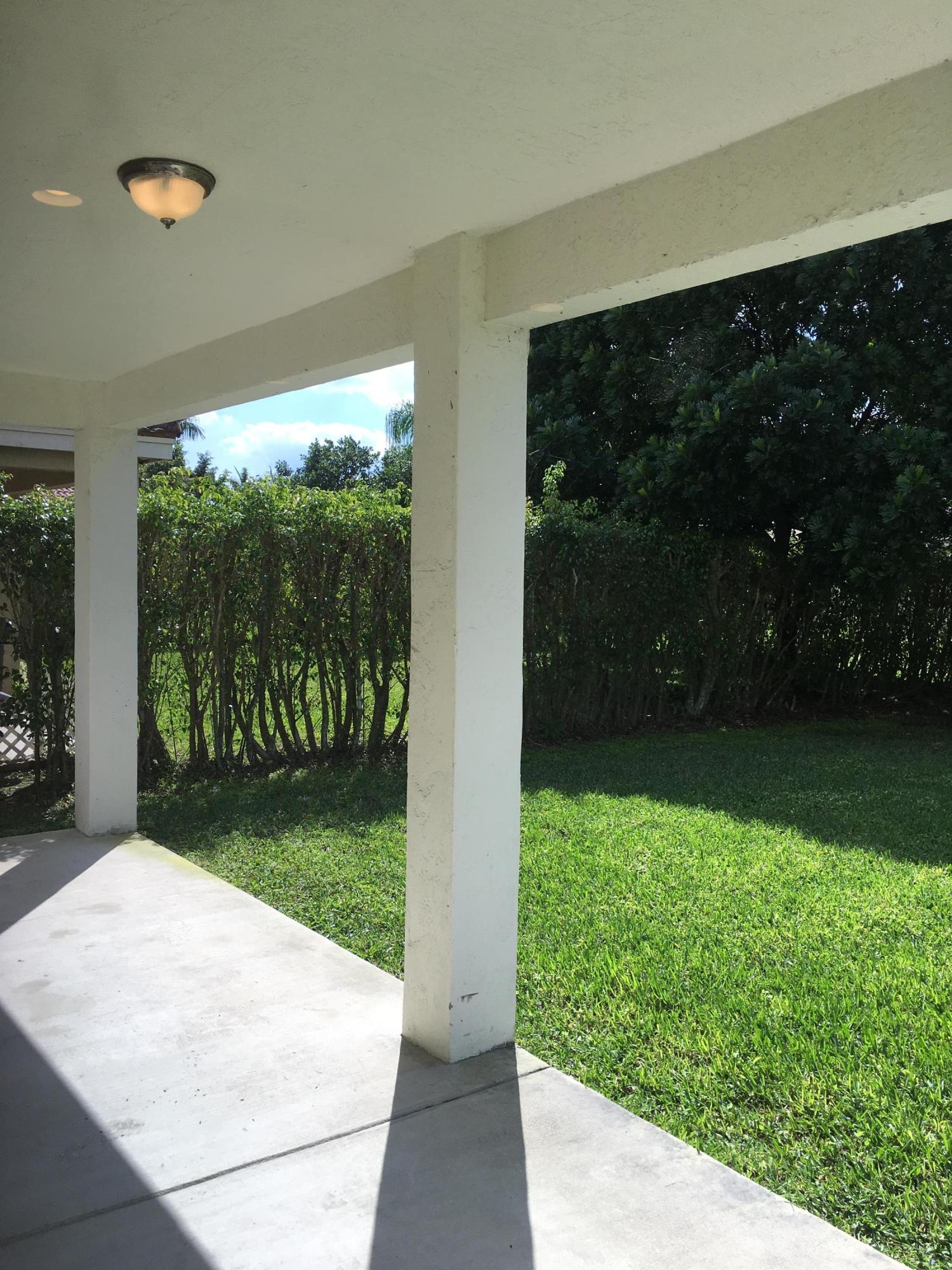 4383 Laurel Ridge Circle Weston, FL 33331 - Photo 32 of 36 a view of backyard with garden