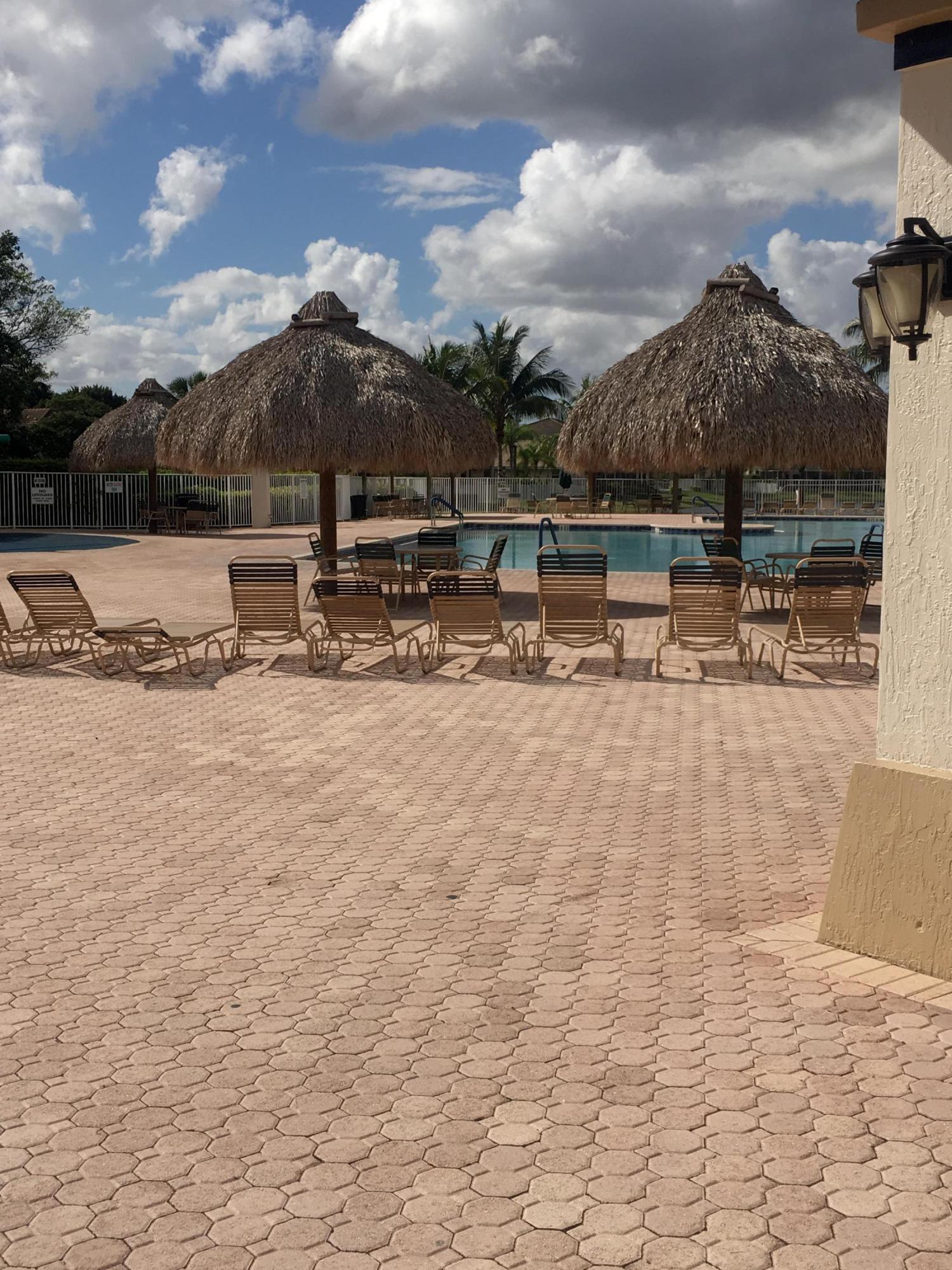 4383 Laurel Ridge Circle Weston, FL 33331 - Photo 36 of 36 a view of a terrace with a bench