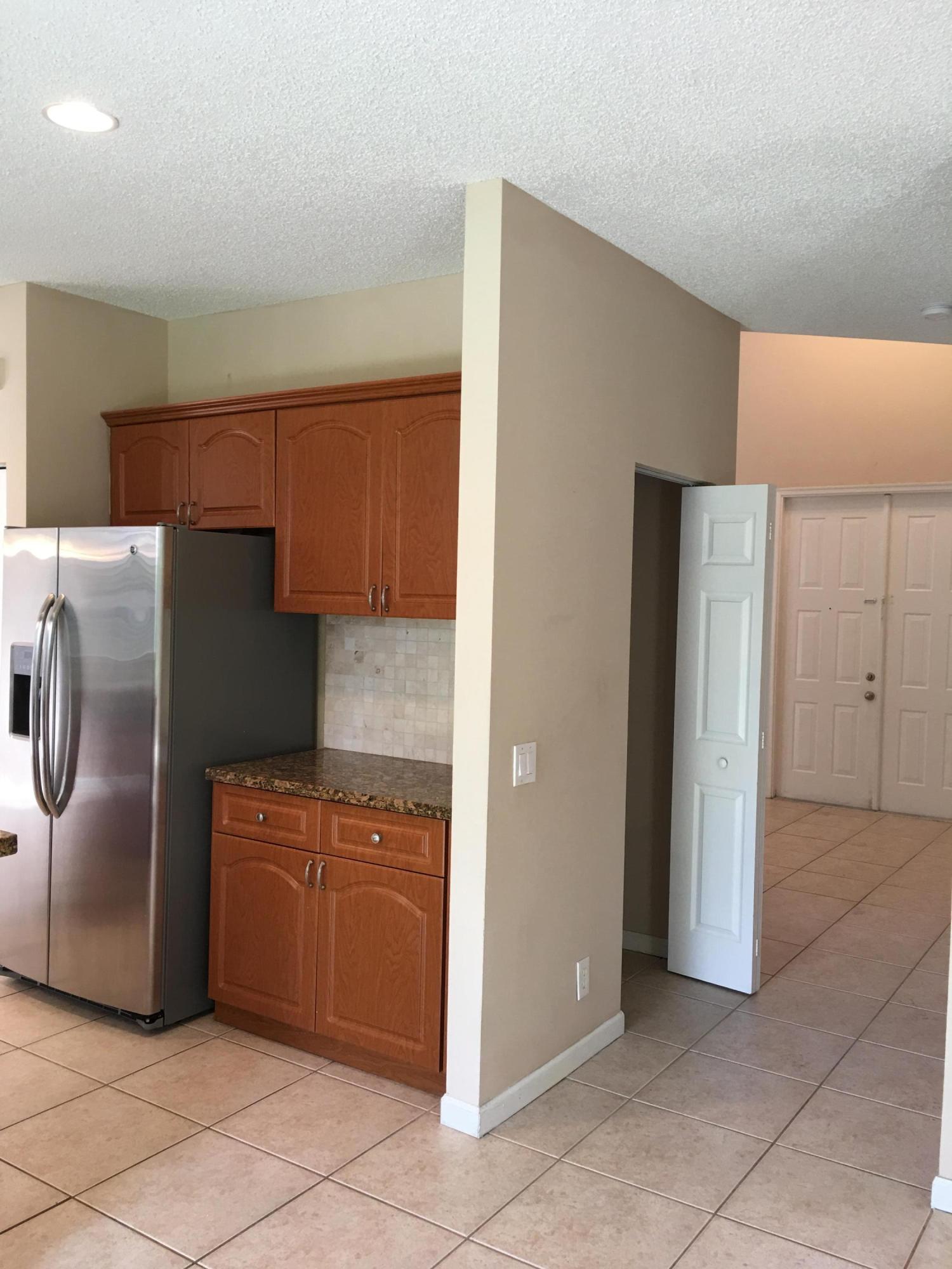 4383 Laurel Ridge Circle Weston, FL 33331 - Photo 9 of 36 a kitchen with stainless steel appliances granite countertop a refrigerator and a sink