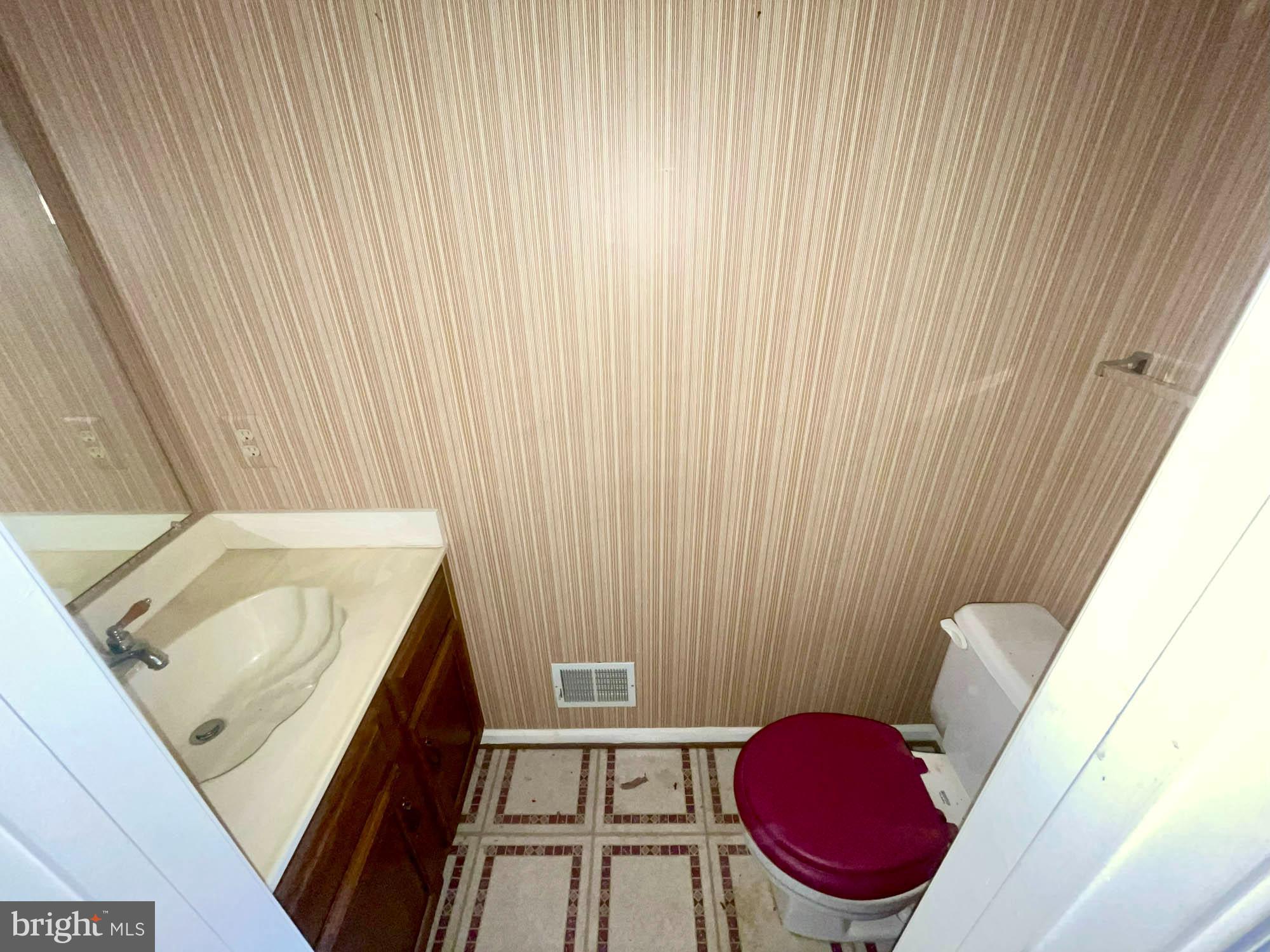 11200 Legato Way Silver Spring, MD 20901 - Photo 12 of 15 a bathroom with a sink and a mirror