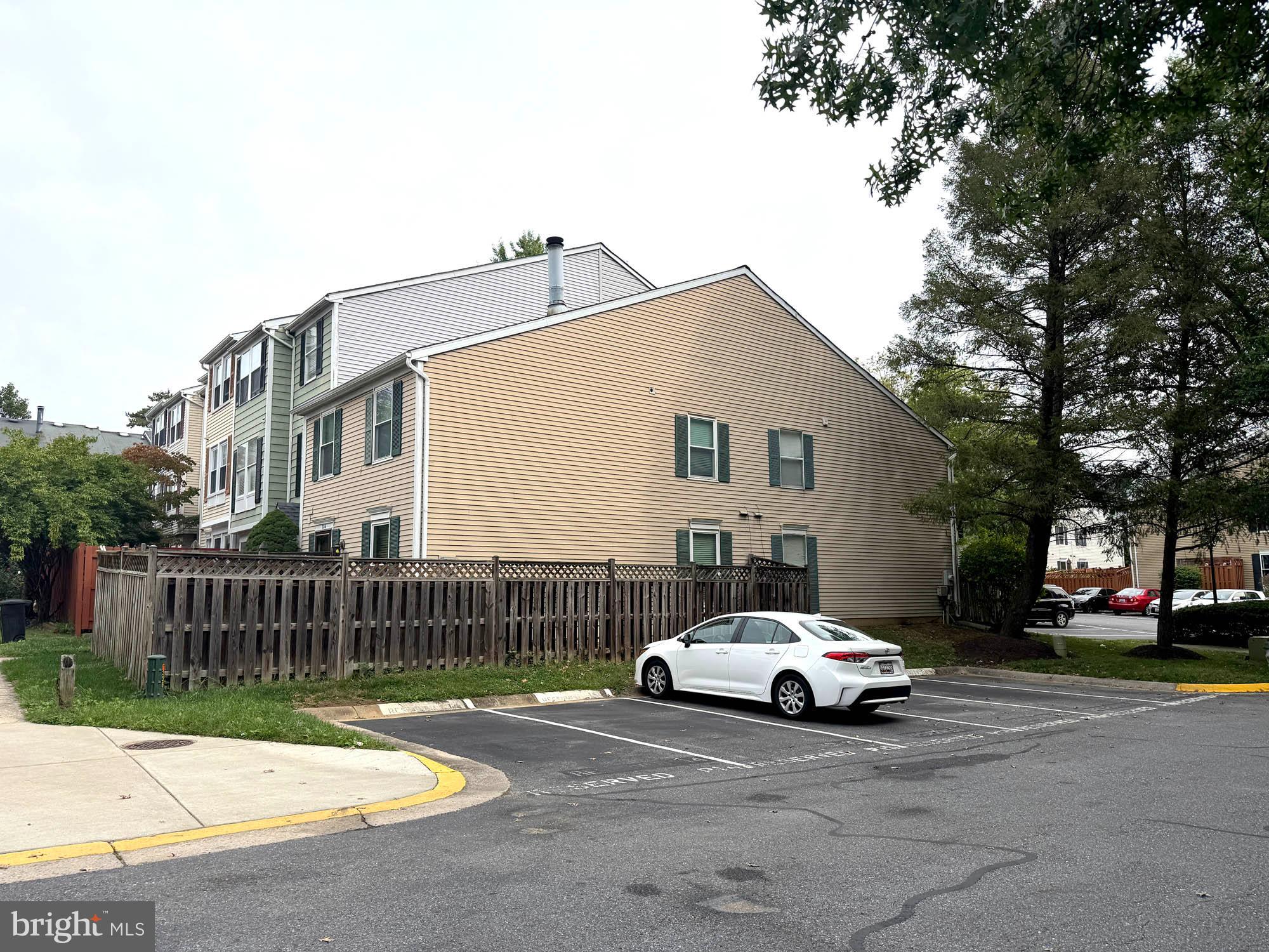 11200 Legato Way Silver Spring, MD 20901 - Photo 15 of 15 a car parked in front of a white house