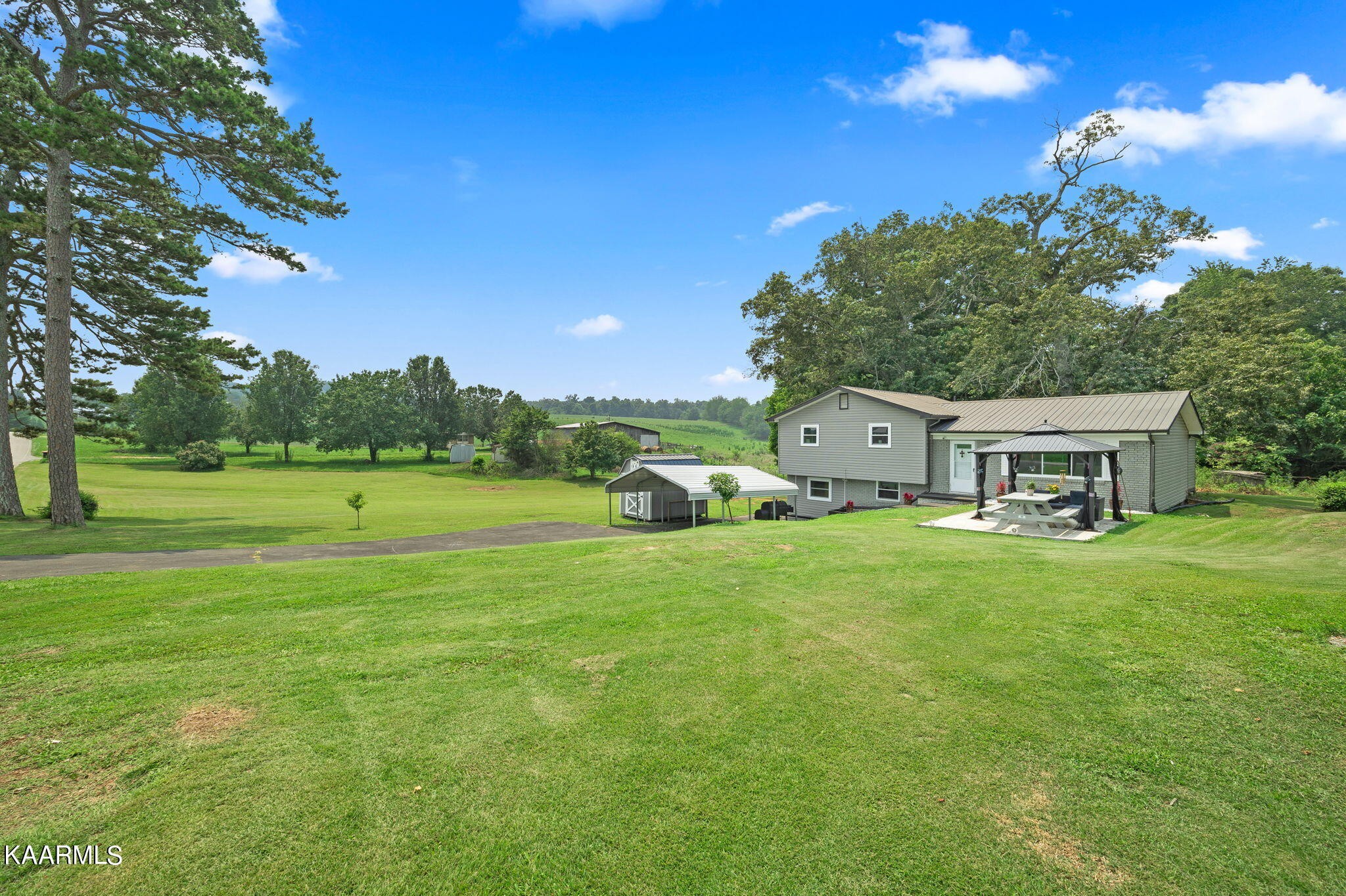 3325 Wade Road West, Unit W Loudon, TN 37774 - Photo 1 of 36 a front view of a house with garden