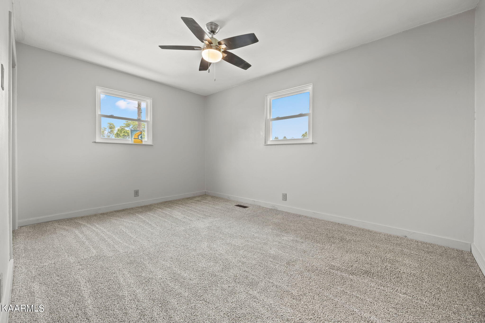 3325 Wade Road West, Unit W Loudon, TN 37774 - Photo 13 of 36 an empty room with a ceiling fan and window