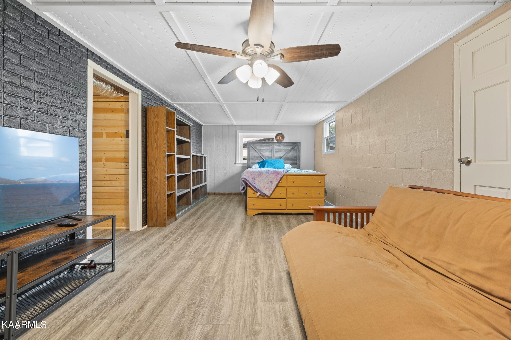 3325 Wade Road West, Unit W Loudon, TN 37774 - Photo 22 of 36 a bedroom with furniture and a flat screen tv