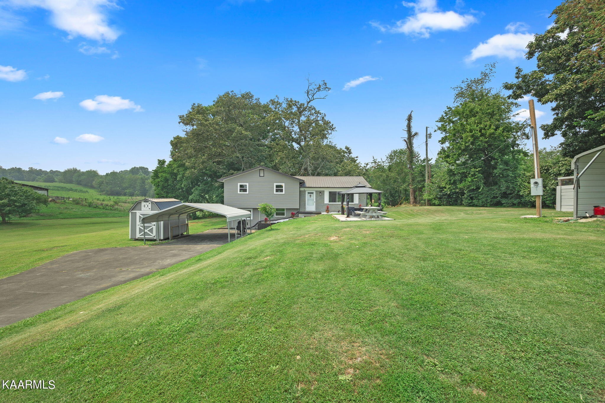 3325 Wade Road West, Unit W Loudon, TN 37774 - Photo 30 of 36 a front view of a house with garden