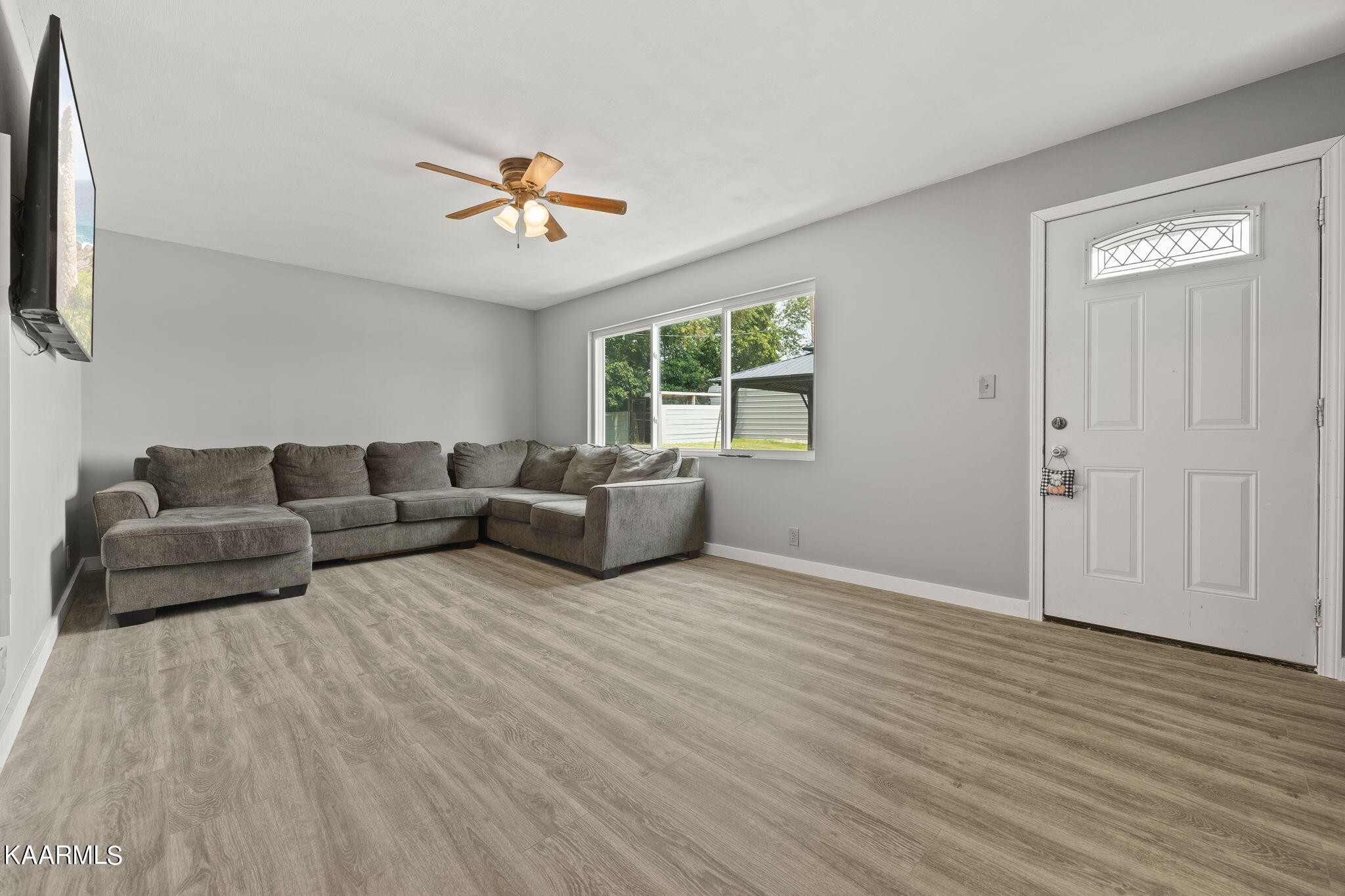 3325 Wade Road West, Unit W Loudon, TN 37774 - Photo 3 of 36 a living room with furniture and a wooden floor