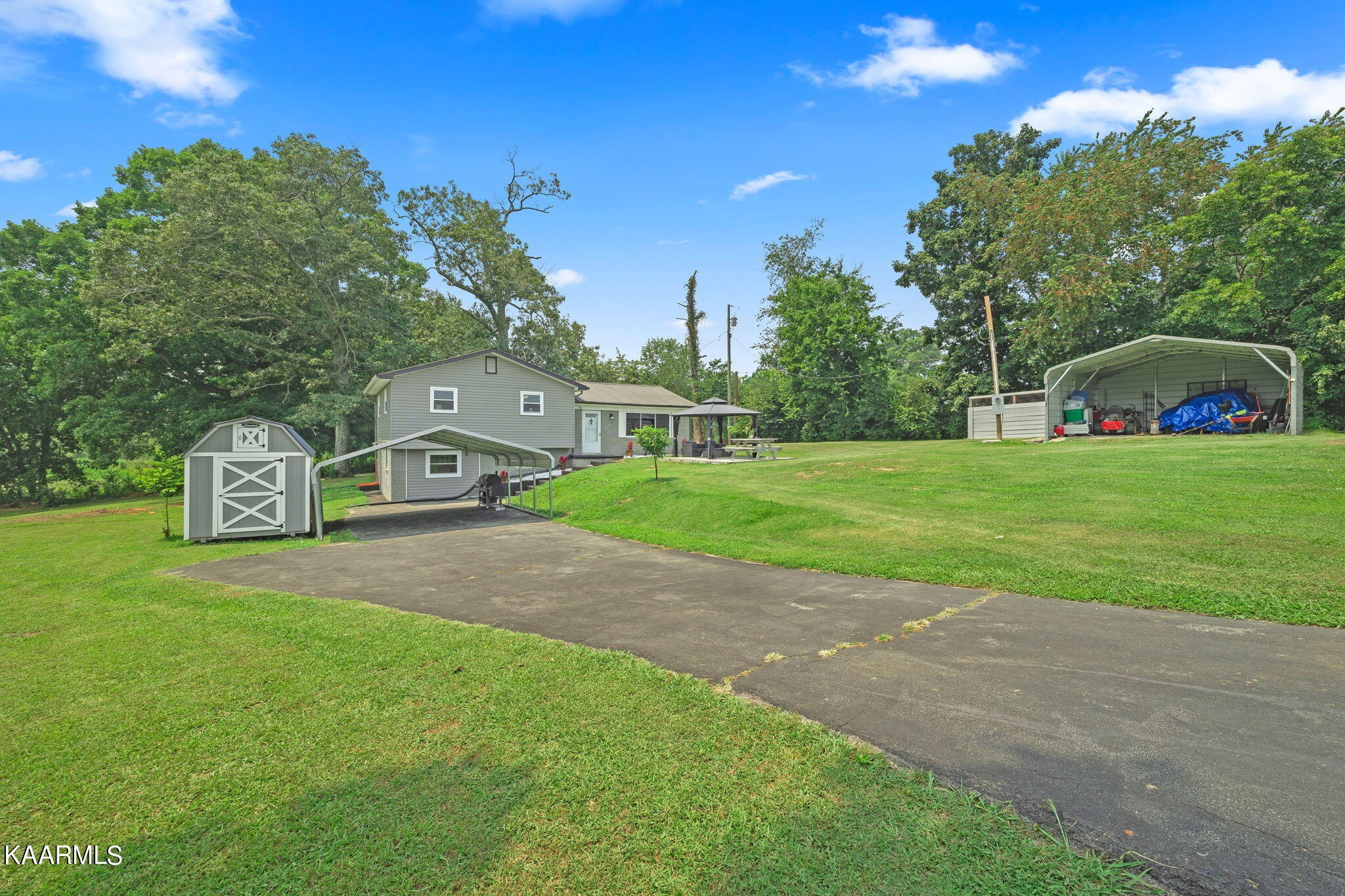 3325 Wade Road West, Unit W Loudon, TN 37774 - Photo 31 of 36 a front view of a house with garden