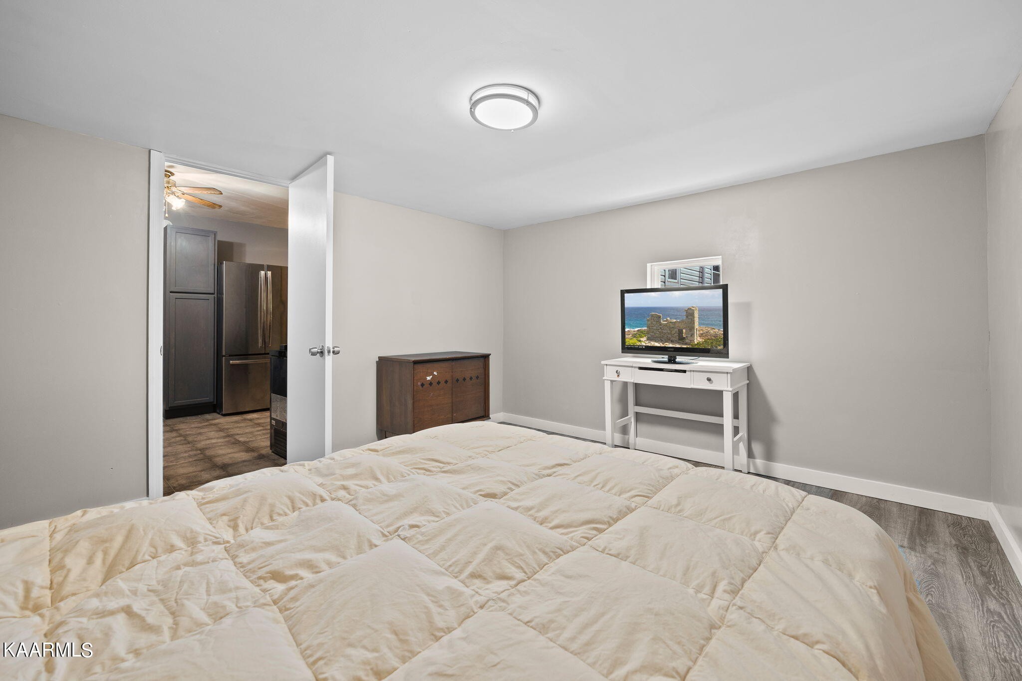 3325 Wade Road West, Unit W Loudon, TN 37774 - Photo 10 of 36 a bedroom with a bed and a television