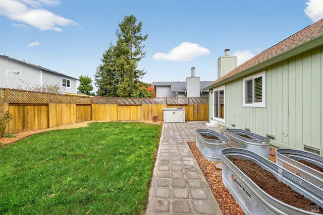a view of a house with a backyard
