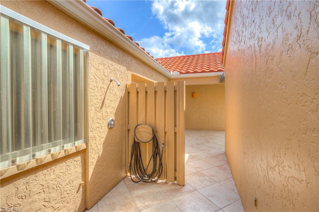 816 Reef Point Circle Naples, FL 34108 - Photo 30 of 30 Outdoor shower btwn garage and front entry
