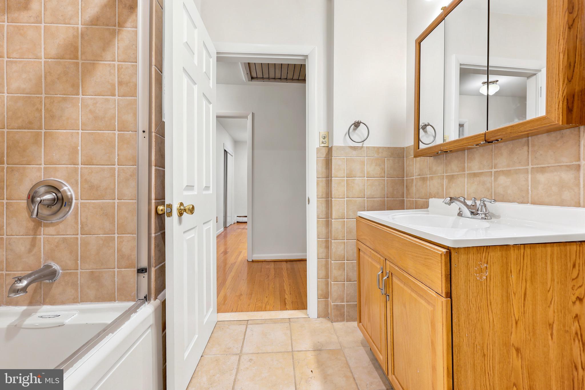 412 Yorkshire Road Bryn Mawr, PA 19010 - Photo 20 of 25 a bathroom with a sink and a mirror