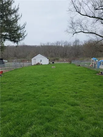 a backyard of a house with lots of green space