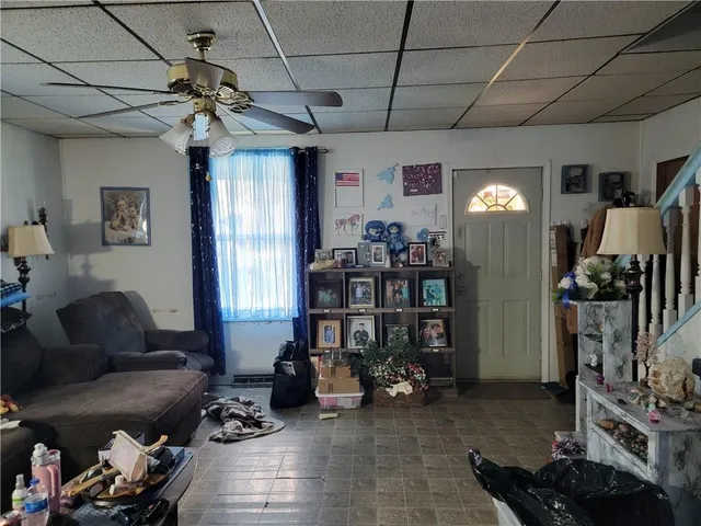 a living room with lots of furniture and a flat screen tv