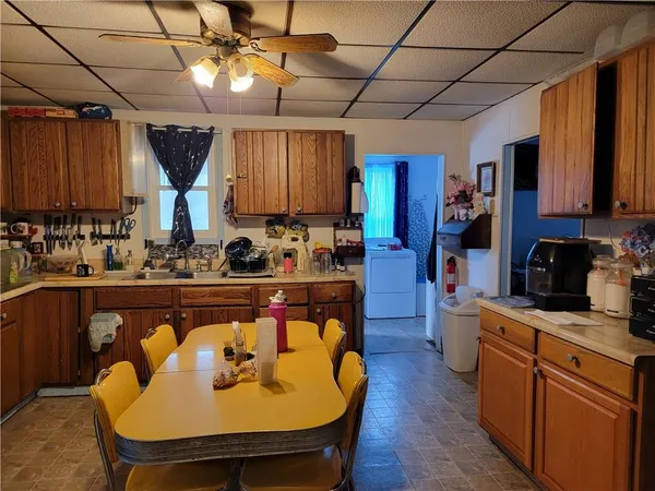 a kitchen with stainless steel appliances granite countertop a sink a stove and a refrigerator