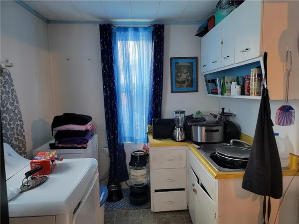 a room with furniture and a flat tv screen