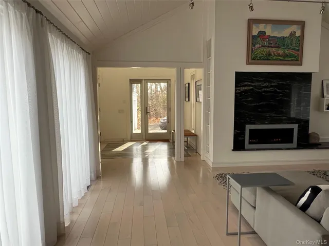 a view of an entryway with wooden floor