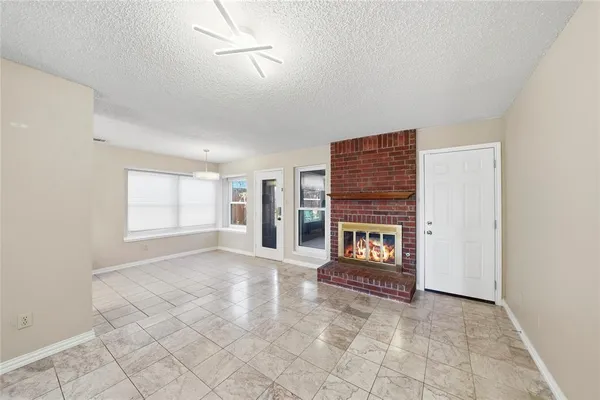 a view of an empty room with glass door