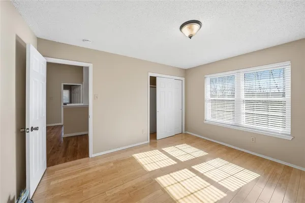 a view of a room with an empty room and window