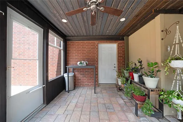 a view of balcony with wooden floor and outdoor seating