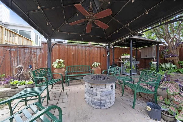 a view of a chairs and table in the patio