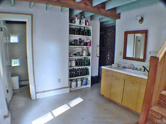 2605 Vanderbilt Avenue Raleigh, NC 27607 - Photo 5 of 10 Back entry room has recessed glass blocks for additional lighting, and attractive back staircase.