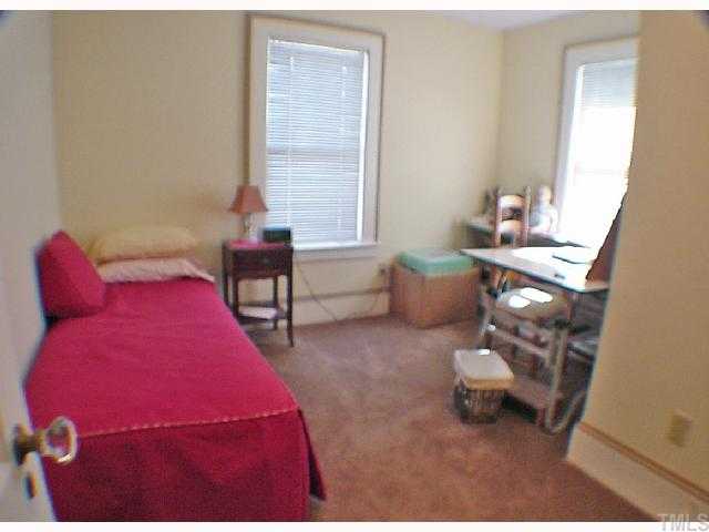 2605 Vanderbilt Avenue Raleigh, NC 27607 - Photo 6 of 10 Third bedroom is configured for a child's bedroom...with shelving and also closet with shelves. There are lots of windows!