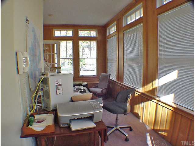 2605 Vanderbilt Avenue Raleigh, NC 27607 - Photo 9 of 10 This bright, windowed space, just off the living room, can be used as an office or sunroom.