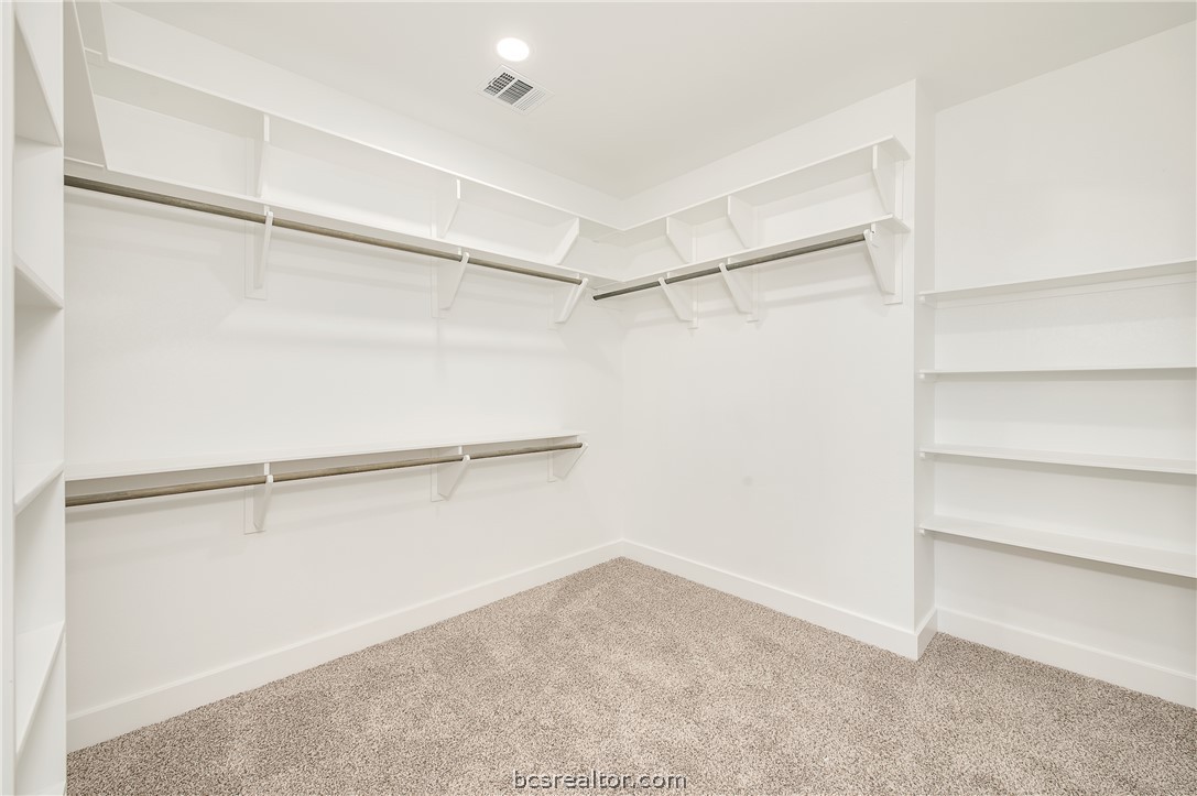 2908 GOLDBERG Drive Bryan, TX 77808 - Photo 31 of 44 Master closet with ample storage, rod and shelves, plus built in shelves and dress mirror not pictured.