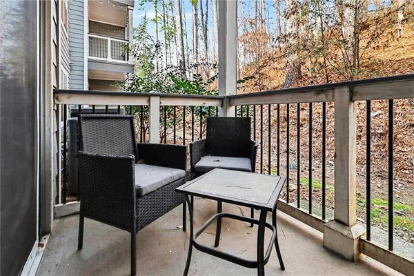 a view of a balcony with furniture