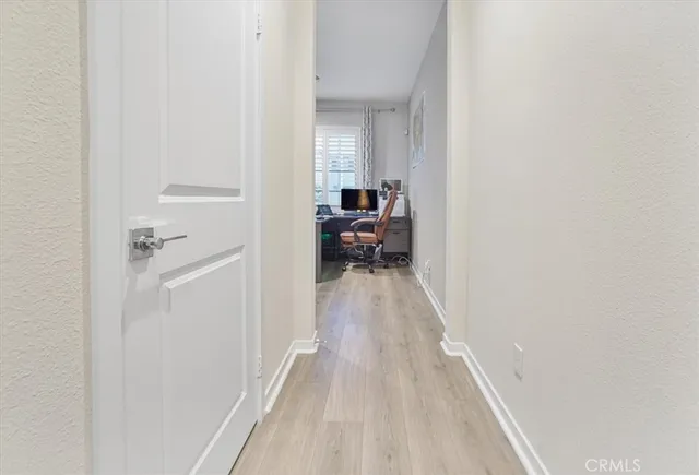 a view of a bedroom from a hallway