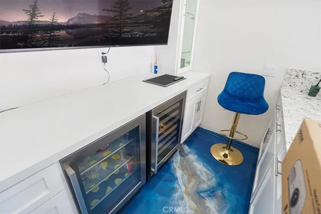 a kitchen with stainless steel appliances granite countertop a sink and a microwave