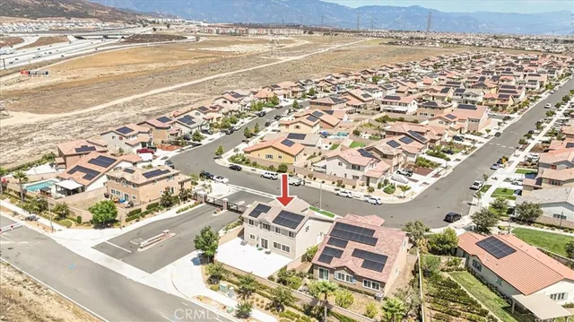 an aerial view of residential building and ocean
