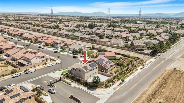 an aerial view of residential houses with outdoor space