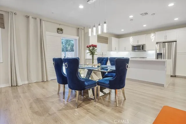 a dining room with furniture and window