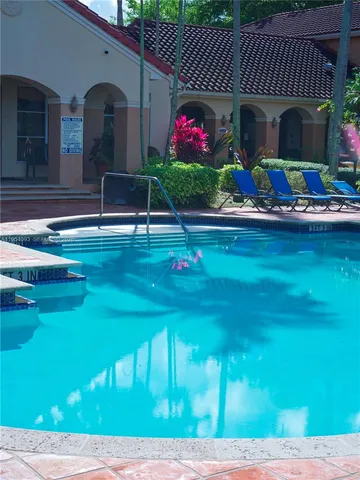 a view of a lake with a house in the background