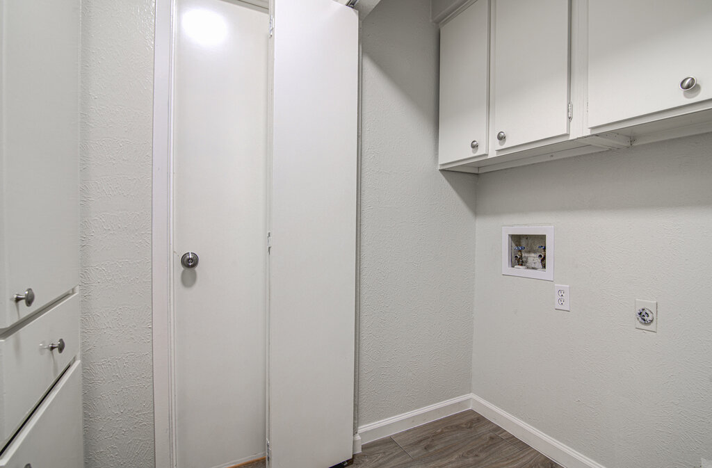 5301 Indio Circle, Unit A Austin, TX 78745 - Photo 14 of 25 Functional laundry room offers upper cabinetry for storage and convenient utility hookups.